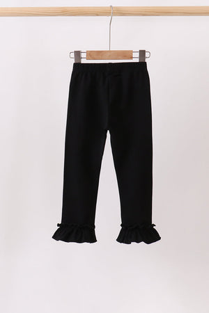 Black ruffle pants