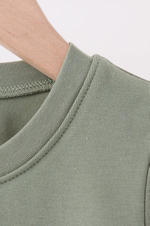 Green pumpkin french knot top