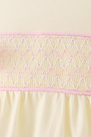 Cream smocked bow bubble