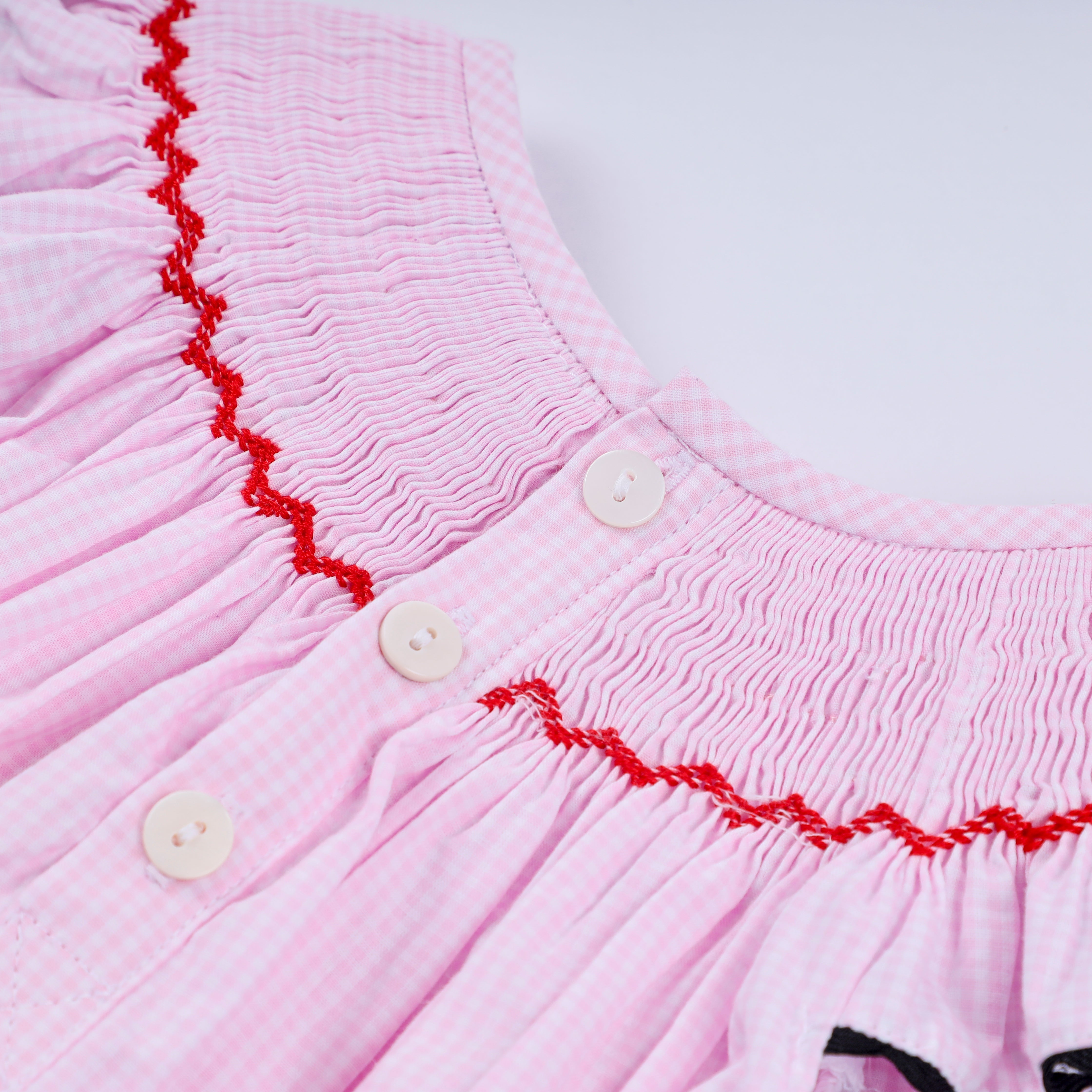Red character hand smocked plaid ruffle bubble