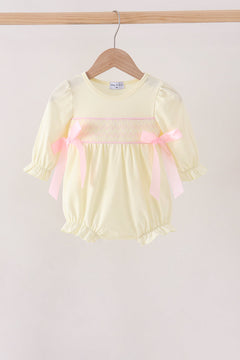Cream smocked bow bubble